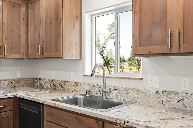 5821 Copeland Rd, Paradise, CA 95969 - kitchen featuring a sink, brown cabinetry, dishwasher, and light stone countertops