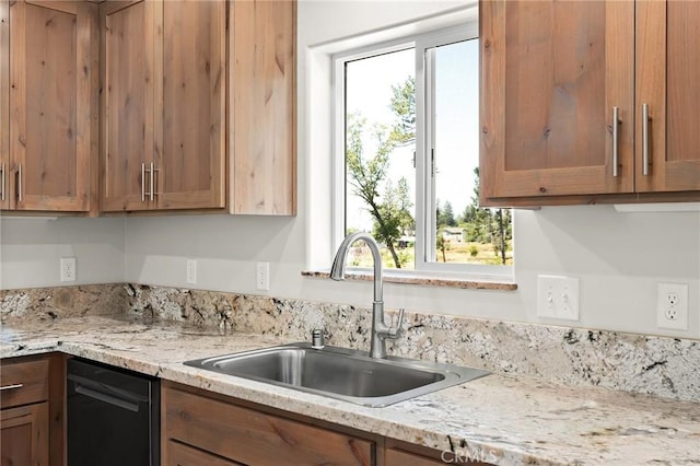 5821 Copeland Rd, Paradise, CA 95969 - kitchen with dishwasher, brown cabinets, and light stone counters