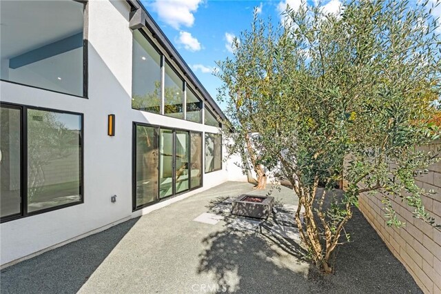 5275 Lynridge Dr, Yorba Linda, CA 92886 - view of yard featuring an outdoor fire pit and a patio area