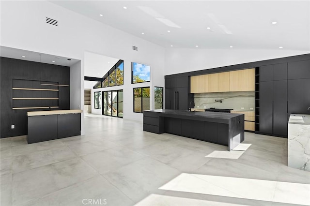 5275 Lynridge Dr, Yorba Linda, CA 92886 - kitchen with modern cabinets, a spacious island, recessed lighting, high vaulted ceiling, and open floor plan