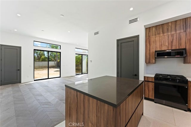 5275 Lynridge Dr, Yorba Linda, CA 92886 - kitchen featuring black gas range oven, modern cabinets, a kitchen island, open floor plan, and recessed lighting