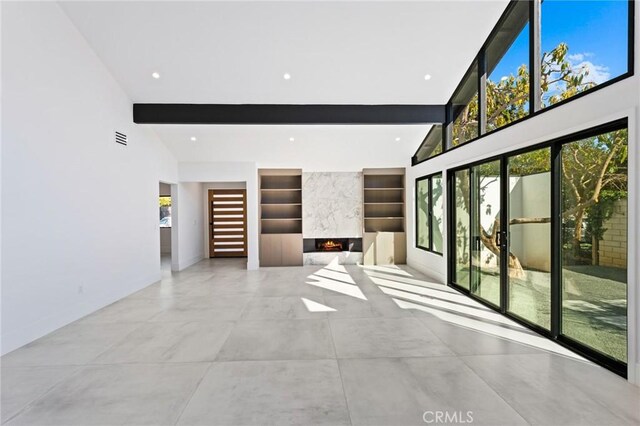 5275 Lynridge Dr, Yorba Linda, CA 92886 - unfurnished living room with built in shelves, beamed ceiling, plenty of natural light, baseboards, and recessed lighting