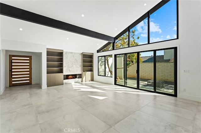 5275 Lynridge Dr, Yorba Linda, CA 92886 - unfurnished living room with built in features, beamed ceiling, a high end fireplace, baseboards, and high vaulted ceiling