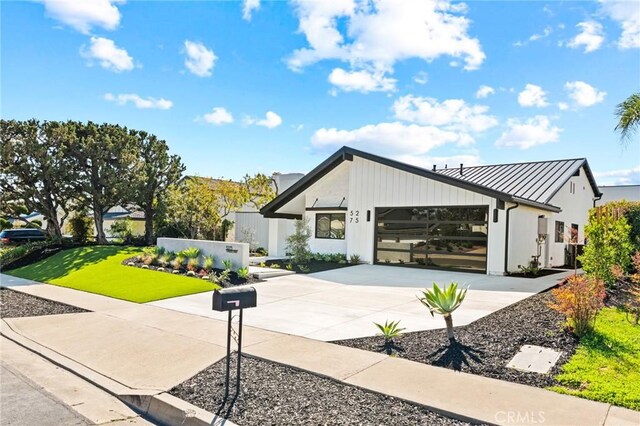 5275 Lynridge Dr, Yorba Linda, CA 92886 - modern inspired farmhouse with a standing seam roof, concrete driveway, an attached garage, and metal roof