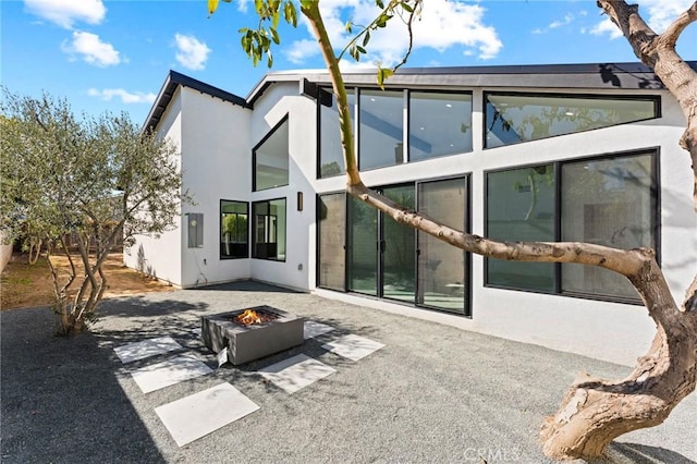 5275 Lynridge Dr, Yorba Linda, CA 92886 - rear view of property with a patio, an outdoor fire pit, and stucco siding