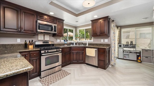 10226 Northridge Dr, Rancho Cucamonga, CA 91737 - kitchen featuring appliances with stainless steel finishes, ornamental molding, dark stone counters, a raised ceiling, and recessed lighting