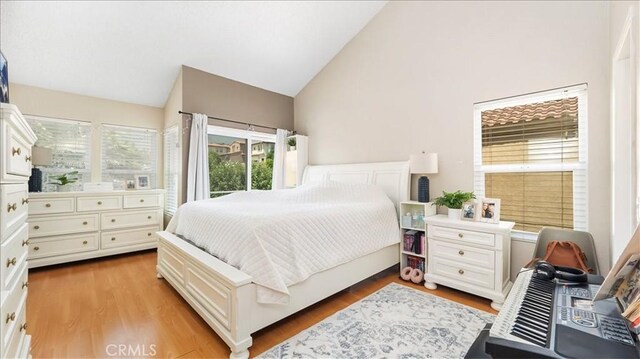 10226 Northridge Dr, Rancho Cucamonga, CA 91737 - bedroom featuring high vaulted ceiling and wood finished floors