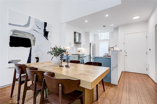 1436 N Detroit St Unit 2, Los Angeles, CA 90046 - dining area with light wood-style floors and recessed lighting