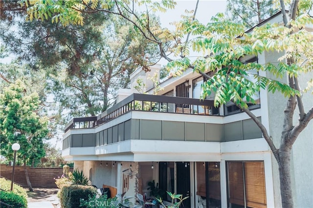 25598 Mont Pointe Unit 4E, Lake Forest, CA 92630 - rear view of house featuring a balcony and stucco siding