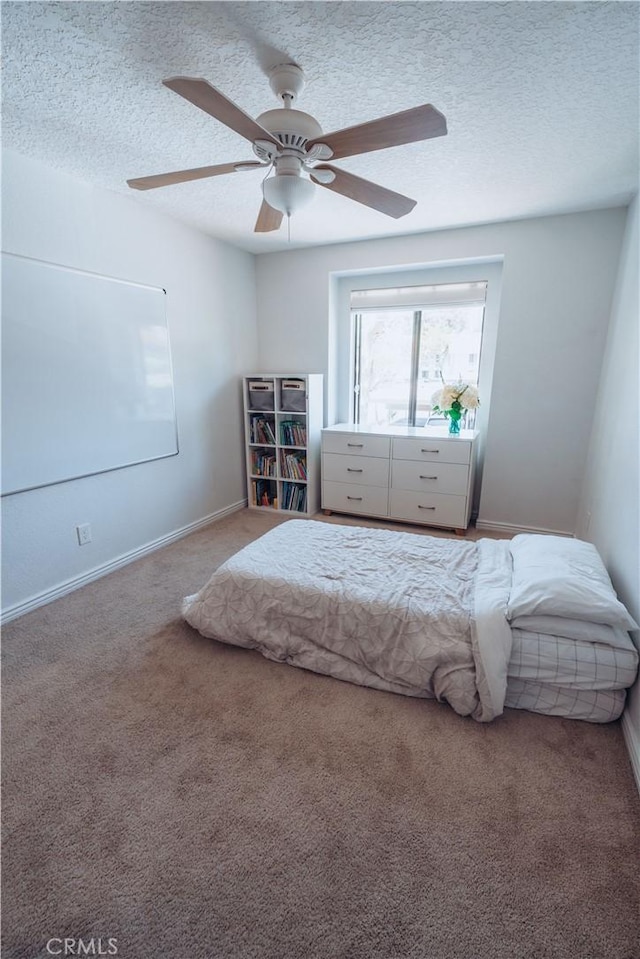 25598 Mont Pointe Unit 4E, Lake Forest, CA 92630 - bedroom with carpet flooring, a textured ceiling, baseboards, and ceiling fan