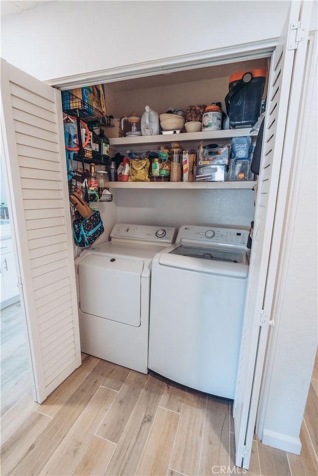 25598 Mont Pointe Unit 4E, Lake Forest, CA 92630 - washroom featuring washing machine and clothes dryer and light wood-style flooring
