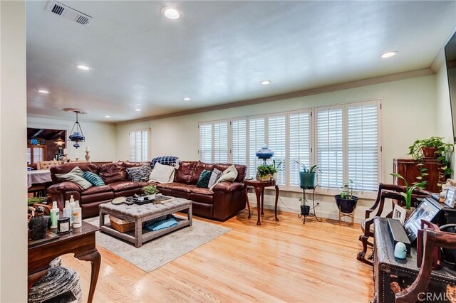 12438 Lambert Cir, Garden Grove, CA 92841 - living area featuring ornamental molding, wood finished floors, recessed lighting, and baseboards