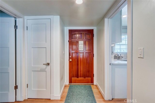 12438 Lambert Cir, Garden Grove, CA 92841 - foyer entrance with light wood finished floors and baseboards