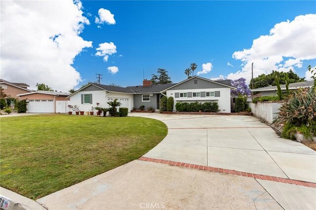 12438 Lambert Cir, Garden Grove, CA 92841 - ranch-style home with concrete driveway, a garage, and a chimney