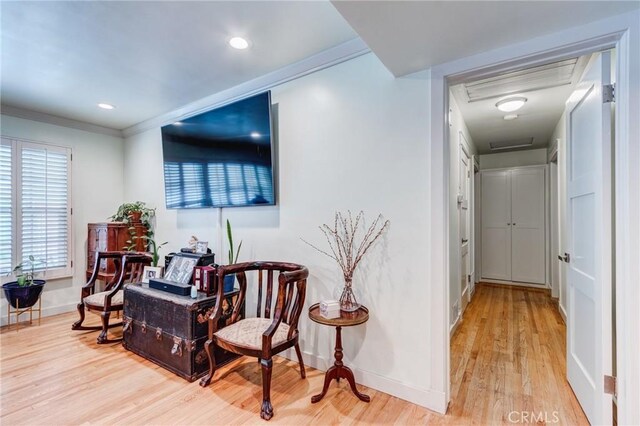 12438 Lambert Cir, Garden Grove, CA 92841 - living area with light wood-type flooring, baseboards, attic access, ornamental molding, and recessed lighting