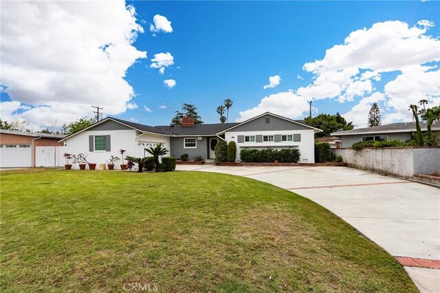 12438 Lambert Cir, Garden Grove, CA 92841 - ranch-style home featuring concrete driveway and a chimney