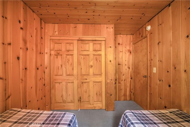 26503 Amador Ln, Lake Arrowhead, CA 92352 - carpeted bedroom with wooden walls, a closet, and wooden ceiling