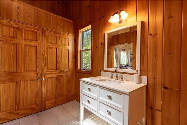26503 Amador Ln, Lake Arrowhead, CA 92352 - bathroom with vanity, wooden walls, and tile patterned flooring