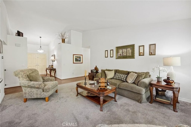 6752 Laurelbrook Dr, Riverside, CA 92506 - living area featuring vaulted ceiling and baseboards