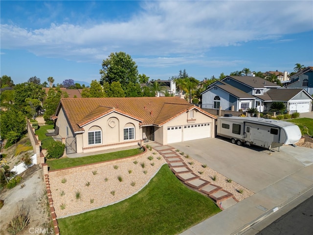 6752 Laurelbrook Dr, Riverside, CA 92506 - view of front of property featuring driveway, an attached garage, stucco siding, a residential view, and a tile roof