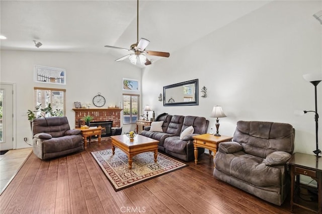 6752 Laurelbrook Dr, Riverside, CA 92506 - living area with a ceiling fan, a fireplace, hardwood / wood-style floors, and high vaulted ceiling
