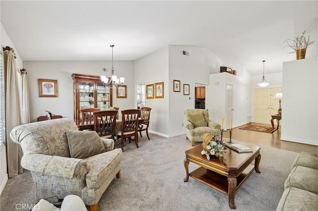 6752 Laurelbrook Dr, Riverside, CA 92506 - living room with vaulted ceiling and a chandelier