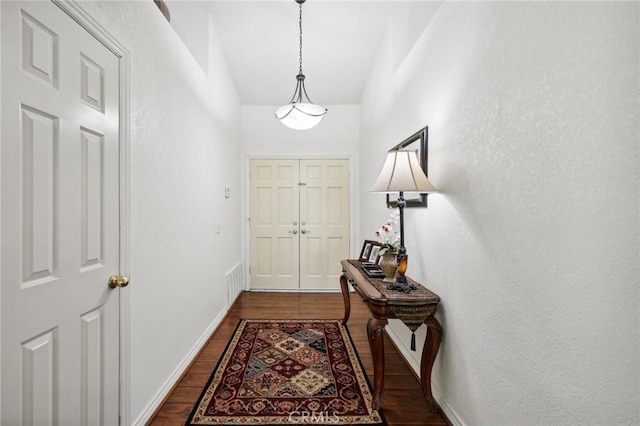 6752 Laurelbrook Dr, Riverside, CA 92506 - entryway with dark wood-style flooring and high vaulted ceiling