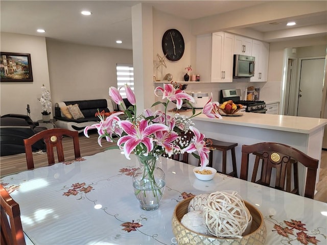 6678 Wrangler Rd, Chino Hills, CA 91709 - dining room with wood finished floors and recessed lighting
