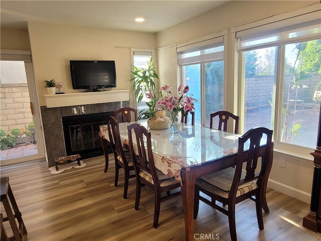 6678 Wrangler Rd, Chino Hills, CA 91709 - dining space with healthy amount of natural light, wood finished floors, recessed lighting, and a premium fireplace