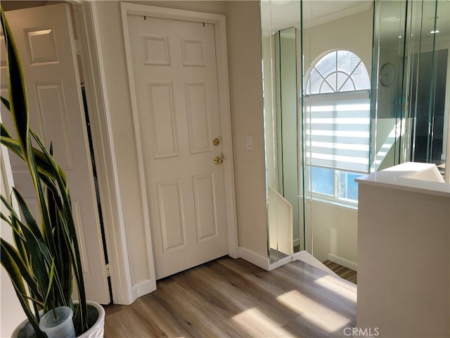 6678 Wrangler Rd, Chino Hills, CA 91709 - foyer entrance featuring plenty of natural light, wood finished floors, and crown molding