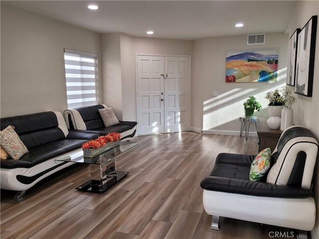 6678 Wrangler Rd, Chino Hills, CA 91709 - living area featuring wood finished floors and recessed lighting