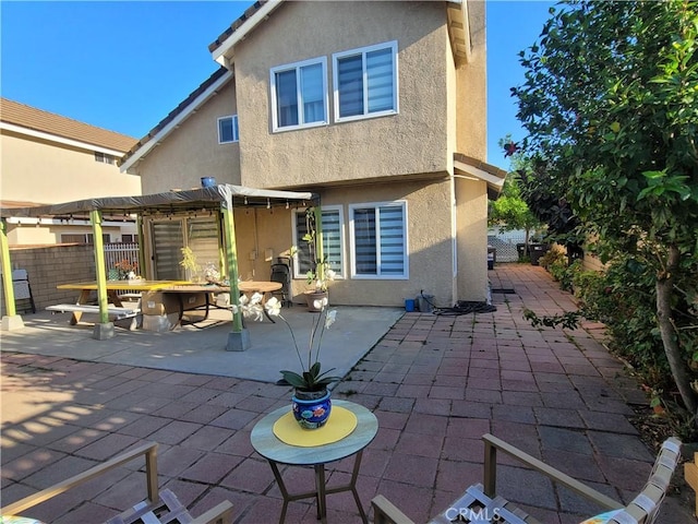 6678 Wrangler Rd, Chino Hills, CA 91709 - back of house with stucco siding, a pergola, a patio area, and outdoor dining space