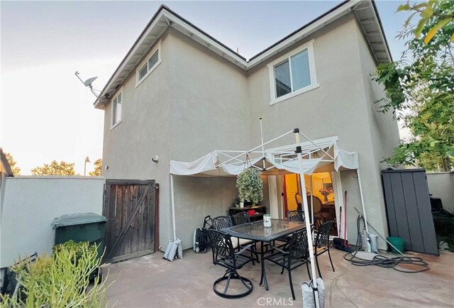 1365 Bonnie Cove Ave, Glendora, CA 91740 - rear view of property with stucco siding, a patio, and outdoor dining space