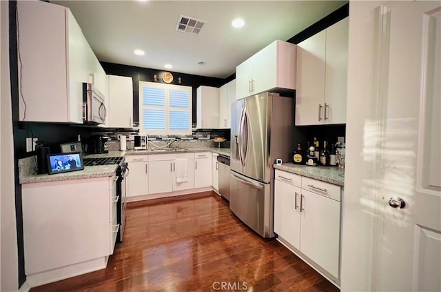1365 Bonnie Cove Ave, Glendora, CA 91740 - kitchen featuring appliances with stainless steel finishes, recessed lighting, dark wood-style floors, white cabinets, and a sink