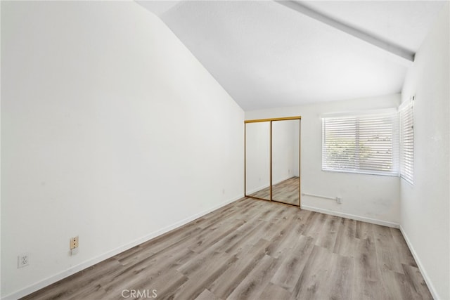 601 San Nicholas Ct Unit 601, Laguna Beach, CA 92651 - unfurnished bedroom with light wood-style floors, a closet, and baseboards