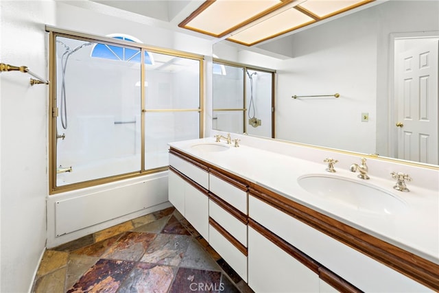 601 San Nicholas Ct Unit 601, Laguna Beach, CA 92651 - full bathroom with stone tile floors, enclosed tub / shower combo, and double vanity