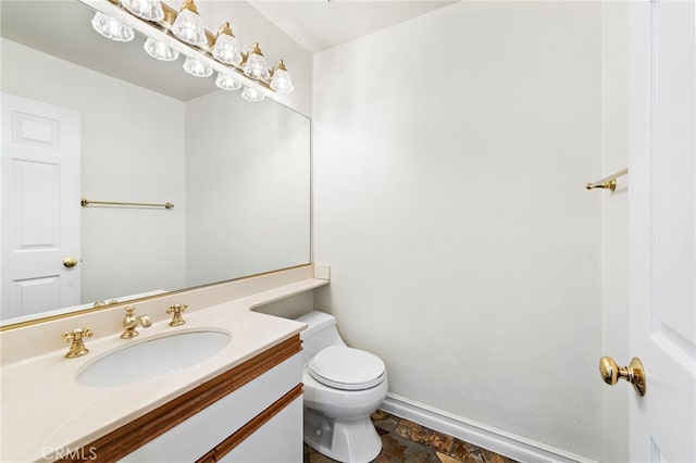 601 San Nicholas Ct Unit 601, Laguna Beach, CA 92651 - half bath featuring toilet, vanity, baseboards, and stone finish flooring