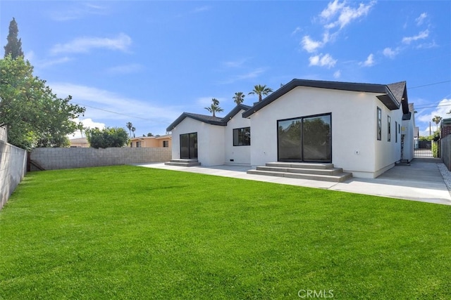 11240 Lull St, Sun Valley, CA 91352 - back of house featuring entry steps, stucco siding, and a patio