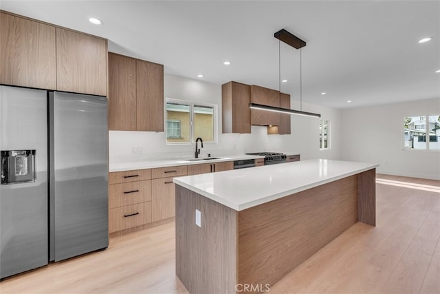 11240 Lull St, Sun Valley, CA 91352 - kitchen with stainless steel refrigerator with ice dispenser, a sink, modern cabinets, light wood finished floors, and recessed lighting