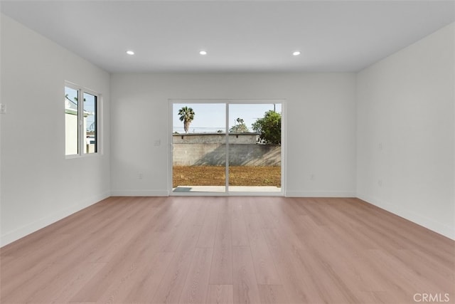11240 Lull St, Sun Valley, CA 91352 - unfurnished room featuring plenty of natural light, light wood finished floors, recessed lighting, and baseboards