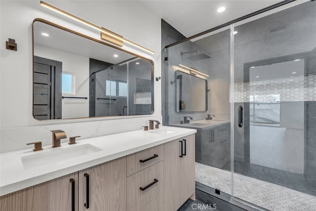 11240 Lull St, Sun Valley, CA 91352 - full bathroom featuring a stall shower, double vanity, and recessed lighting