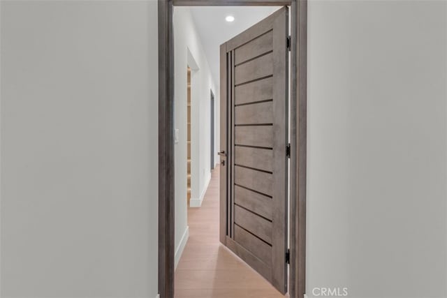11240 Lull St, Sun Valley, CA 91352 - corridor featuring light wood finished floors, recessed lighting, and baseboards