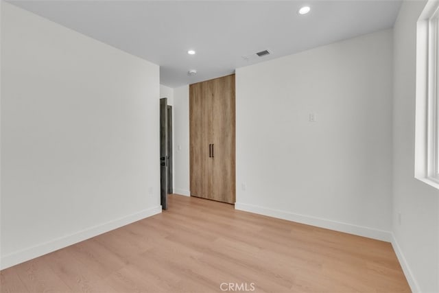 11240 Lull St, Sun Valley, CA 91352 - empty room featuring recessed lighting, light wood-type flooring, and baseboards