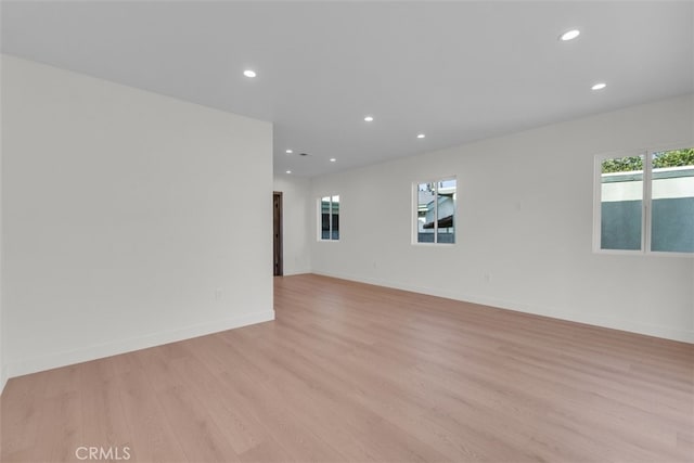 11240 Lull St, Sun Valley, CA 91352 - spare room with light wood-style floors, recessed lighting, and baseboards