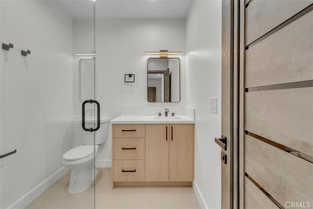 11240 Lull St, Sun Valley, CA 91352 - full bath with baseboards, vanity, toilet, and tile patterned floors