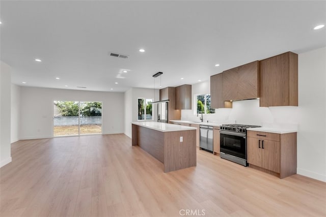 11240 Lull St, Sun Valley, CA 91352 - kitchen featuring stainless steel appliances, modern cabinets, a center island, light wood-style flooring, and recessed lighting