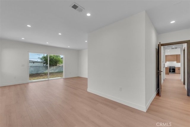 11240 Lull St, Sun Valley, CA 91352 - spare room with light wood-style floors, recessed lighting, and baseboards