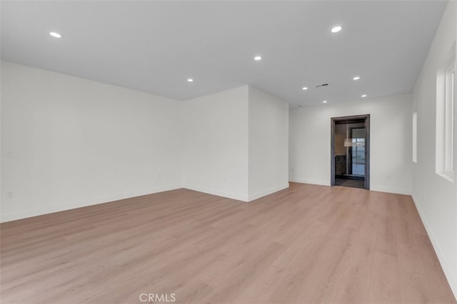 11240 Lull St, Sun Valley, CA 91352 - unfurnished room featuring light wood-style floors, recessed lighting, and baseboards
