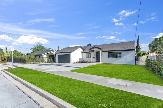 11240 Lull St, Sun Valley, CA 91352 - view of front of house featuring concrete driveway, stucco siding, and a garage
