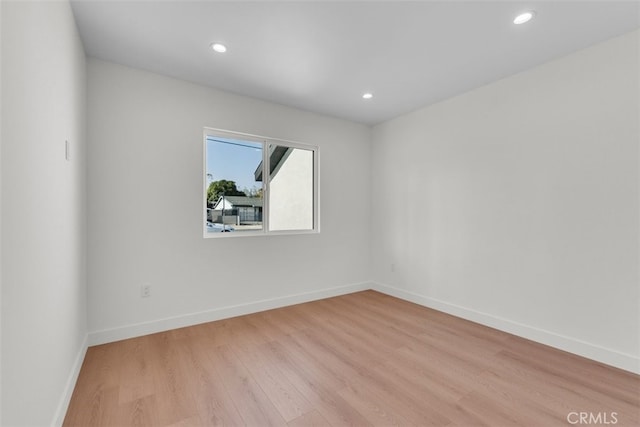 11240 Lull St, Sun Valley, CA 91352 - unfurnished room featuring light wood-type flooring, recessed lighting, and baseboards